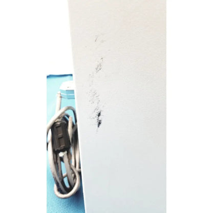 A smudged black mark on a white surface of the perkin elmer peri pump cjl8002 janus g3 workstation component