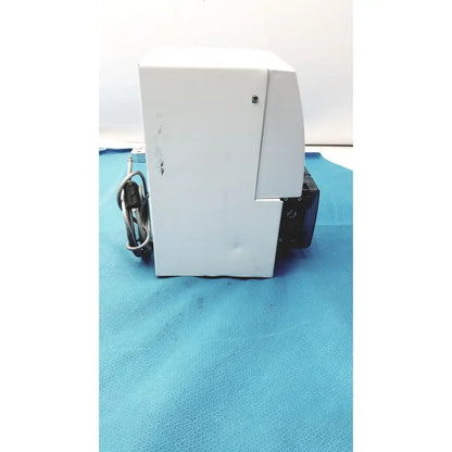 White rectangular Perkin Elmer peri pump cjl8002 with black side component and coiled cables for Janus G3 workstation use