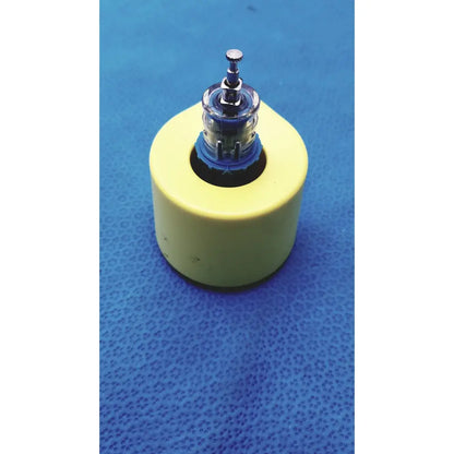 Yellow cylindrical base medical nio adult simulation kit with clear glass bulb and metallic top by persys medical nio