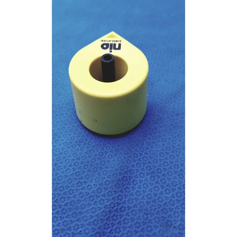Yellow plastic persys medical nio adult simulation kit with black cylindrical insert for nio adult simulation use