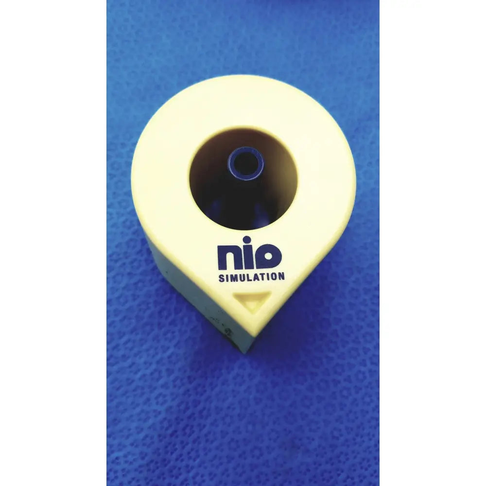 Yellow plastic Persys Medical Nio adult simulation kit device with circular opening and blue inner component for nio adult simulation