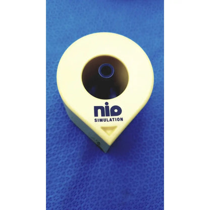 Yellow plastic Persys Medical Nio adult simulation kit device with circular opening and blue inner component for nio adult simulation