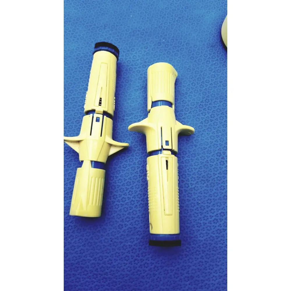 Yellow plastic insulin pens with blue accents and ergonomic grips in persys medical nio adult simulation kit