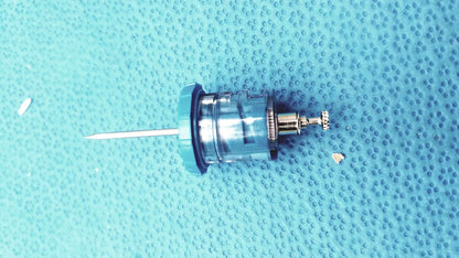 Blue plastic and metal faucet cartridge with silver needle-like protrusion for persys medical nio adult simulation kit