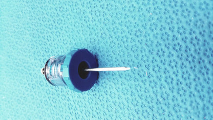 Blue plastic syringe with clear barrel and white needle in persys medical nio adult simulation kit for medical nio adult use
