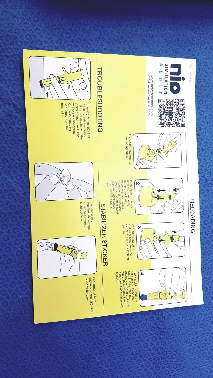 Yellow nio a10 stabilization guide leaflet with illustrated instructions for troubleshooting and reloading in persys medical nio adult simulation kit