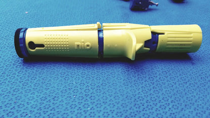Yellow and blue plastic persys medical nio adult simulation device with textured grip sections for medical training