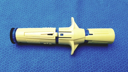 Yellow plastic surgical drill bit with blue accents and textured grip from persys medical nio adult simulation kit