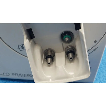 White plastic housing with three metallic nozzles including one green accent of philips intellivue g7m module