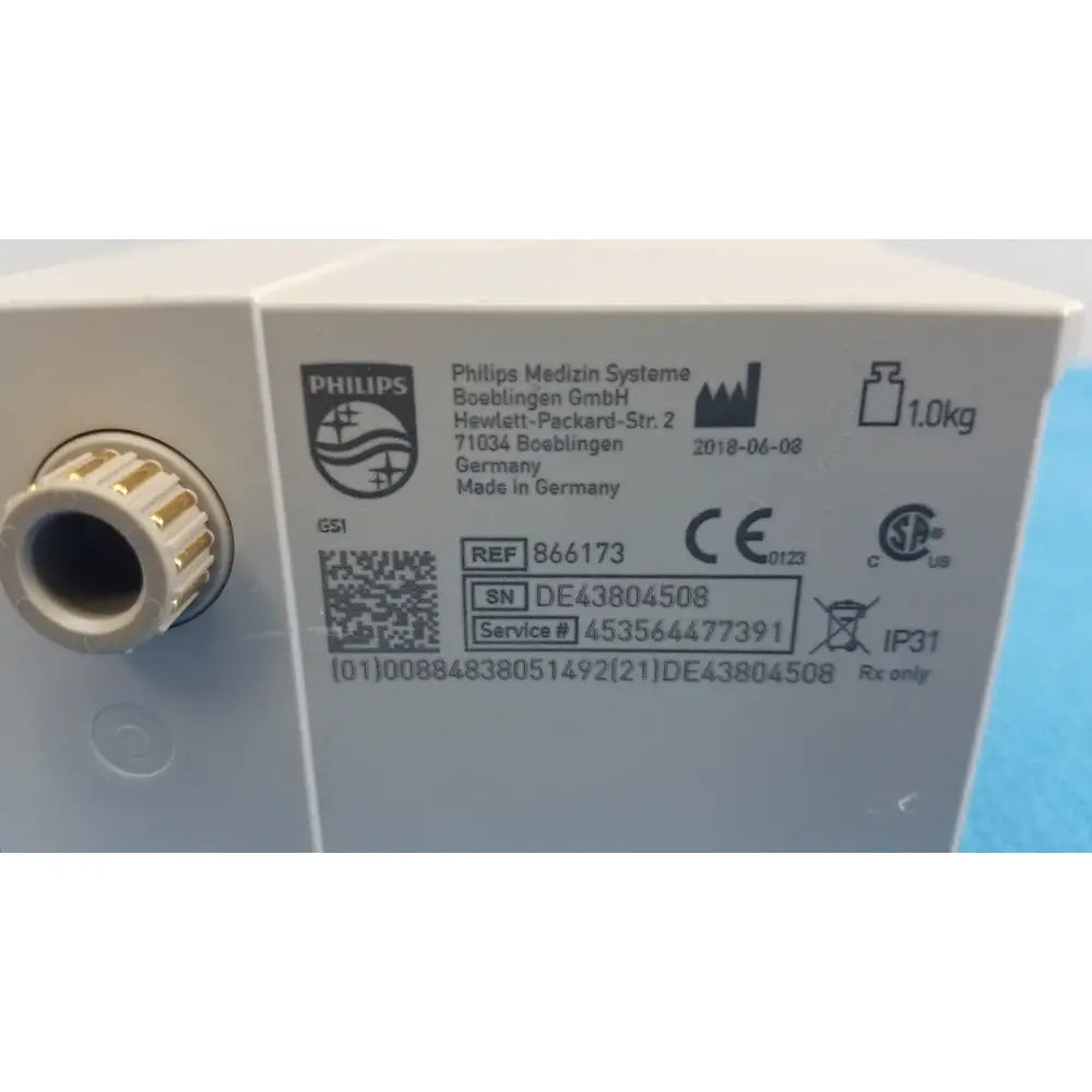 White philips intellivue g7m module medical device with gold threaded connector and regulatory markings shown from back side