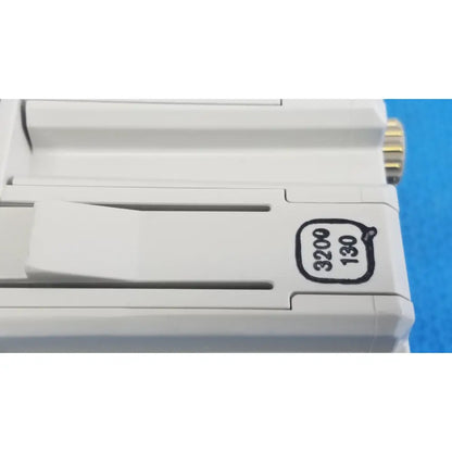 White plastic Philips intellivue g7m module camera body with gold screw head and black engraved markings
