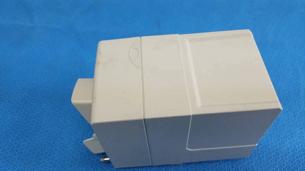 Beige plastic electrical outlet box with rectangular design and mounting clips for Philips intellivue g7m module