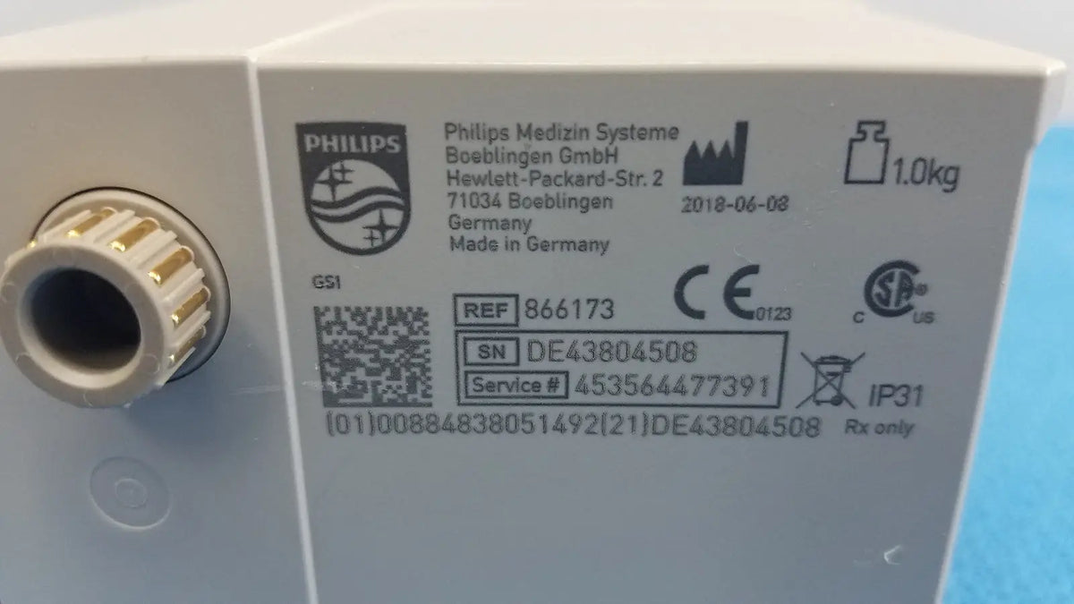 White philips intellivue g7m module medical device with gold threaded connector and regulatory markings shown from back side