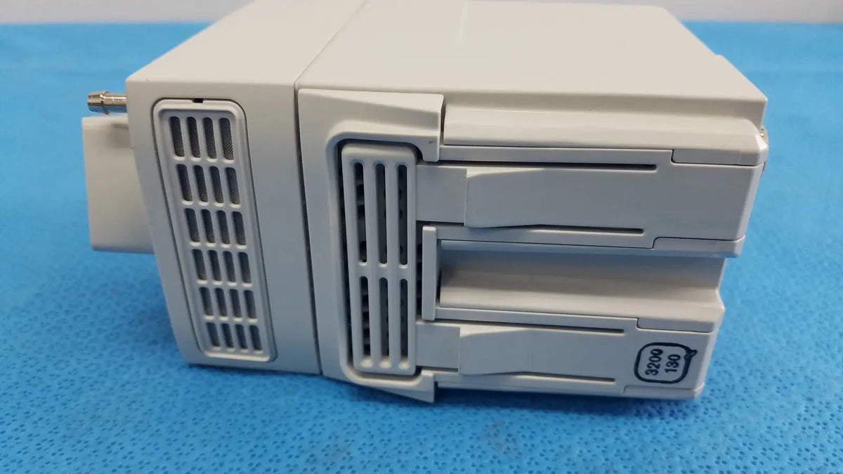 White plastic philips intellivue g7m module 3200/190 with vertical ventilation grilles and stacked drawers