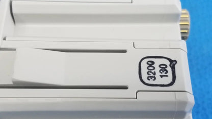 White plastic Philips intellivue g7m module camera body with gold screw head and black engraved markings