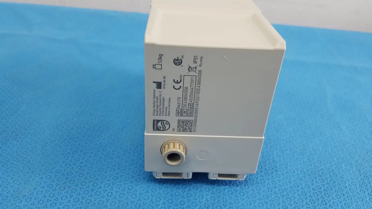 White plastic philips intellivue g7m module electrical outlet with gold threaded connector and certification markings on side