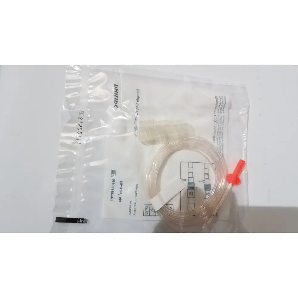 Philips 989803182911 microstream filterline set with clear plastic tubing and bright red connector in medical-grade bag