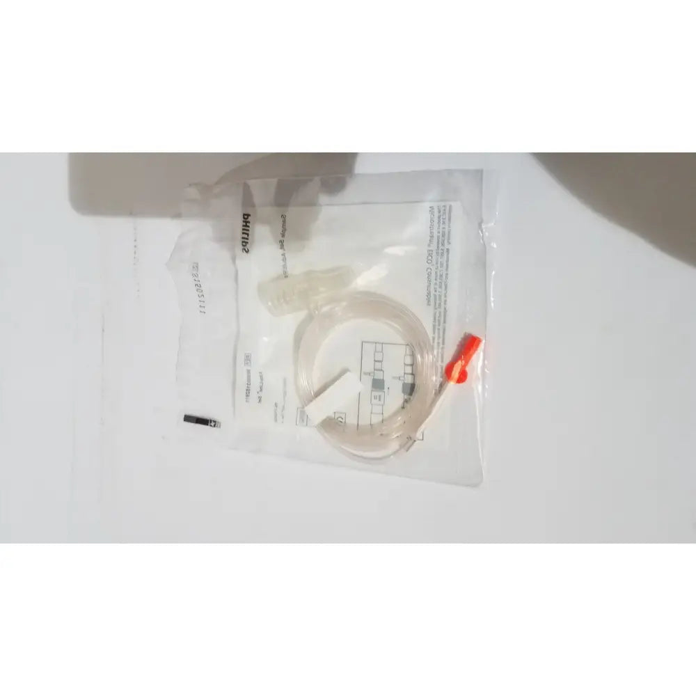 Clear plastic microstream filterline set tubing with bright orange cap in transparent Philips bag for adult and pediatric use