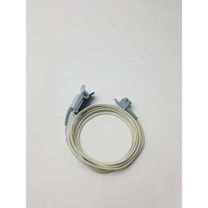 Beige philips adult finger probe spo2 sensor cable with light gray plastic connectors coiled neatly on plain surface