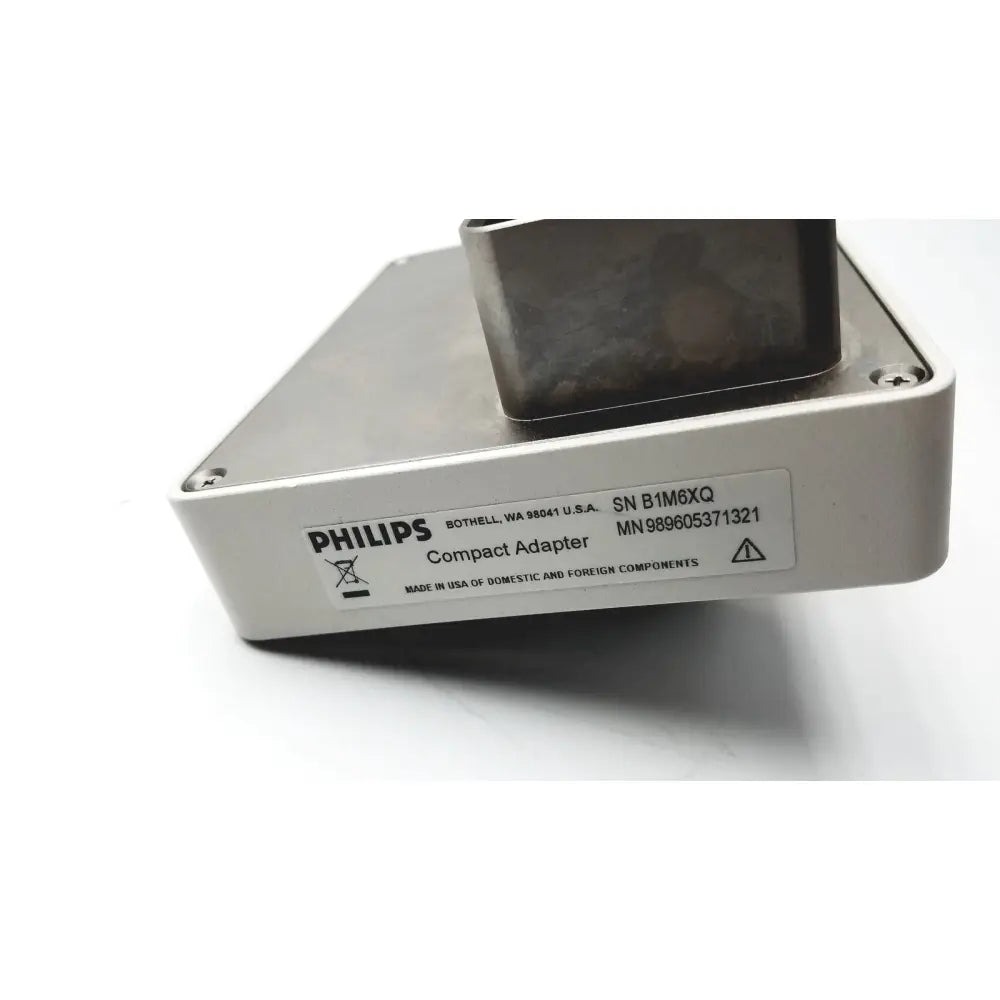 Philips compact adapter with silver metallic casing and black component for ultra sound accessories use