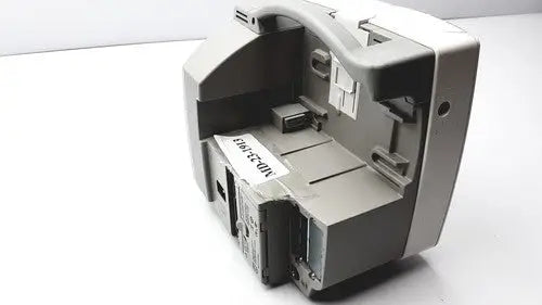 Gray plastic cash register with curved top and multiple compartments shown with philips intellivue m4605a mp30 patient monitor