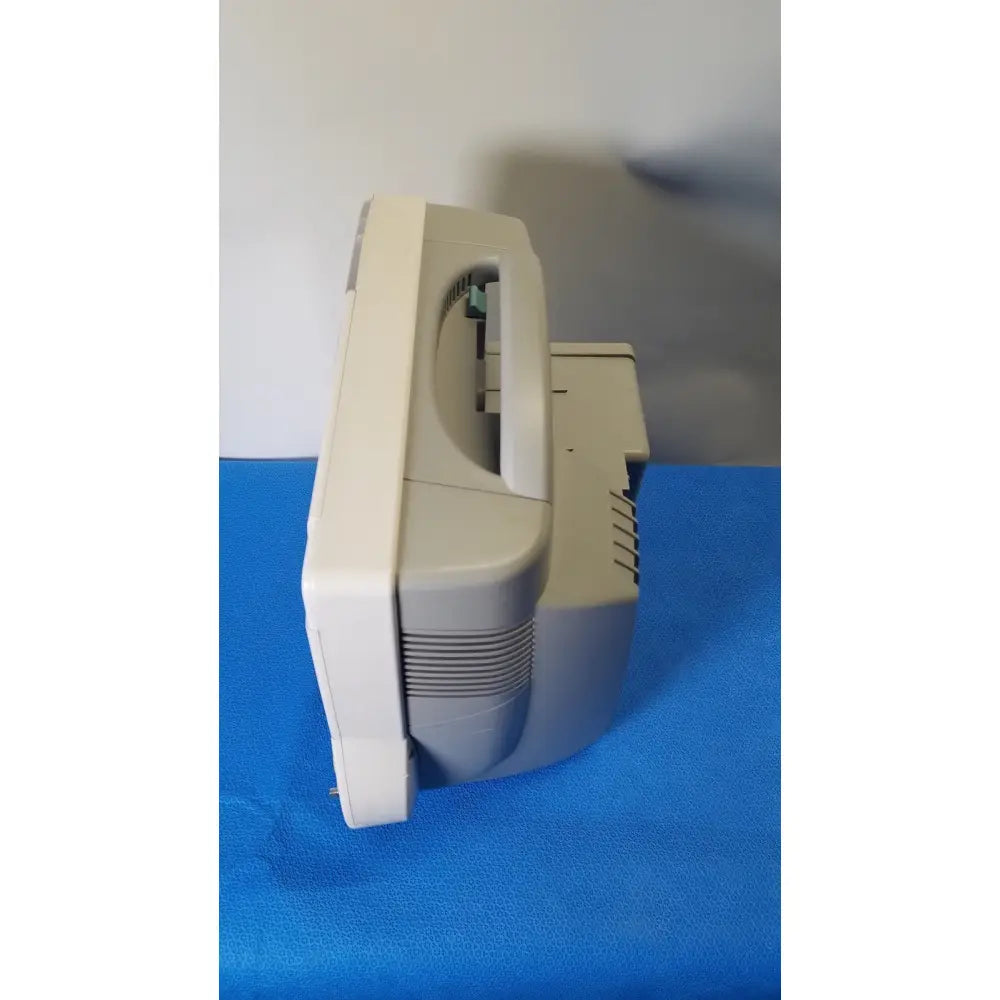 Beige plastic philips intellivue m8105a patient monitor with curved crt screen and integrated stand