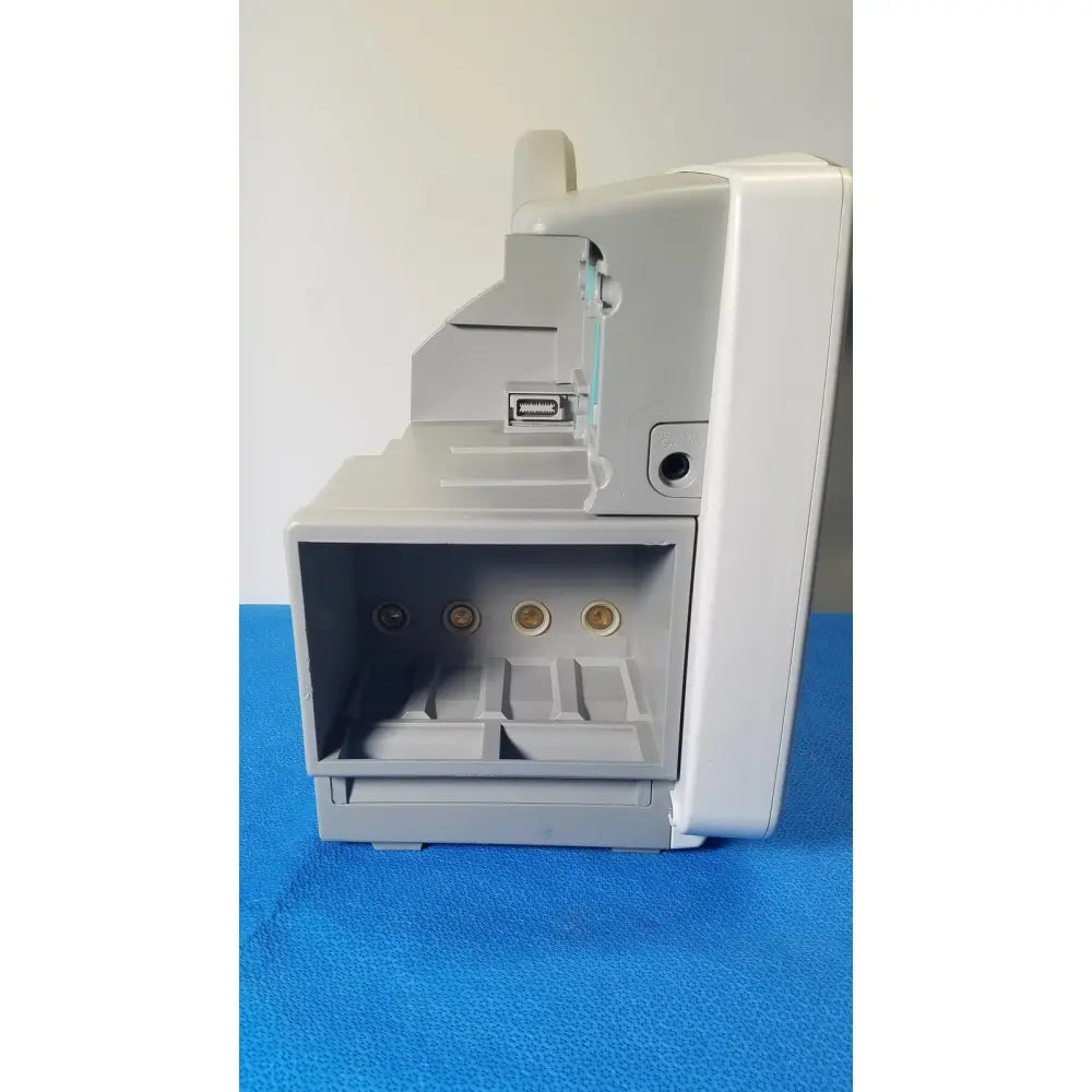 Gray plastic philips intellivue m8105a patient monitor with usb port and three gold circular connectors on front panel