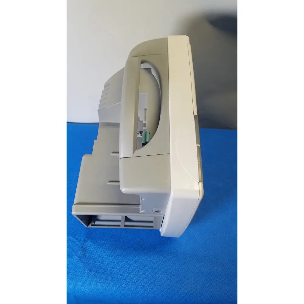 Beige plastic philips intellivue m8105a patient monitor with curved top and integrated handle for medical use