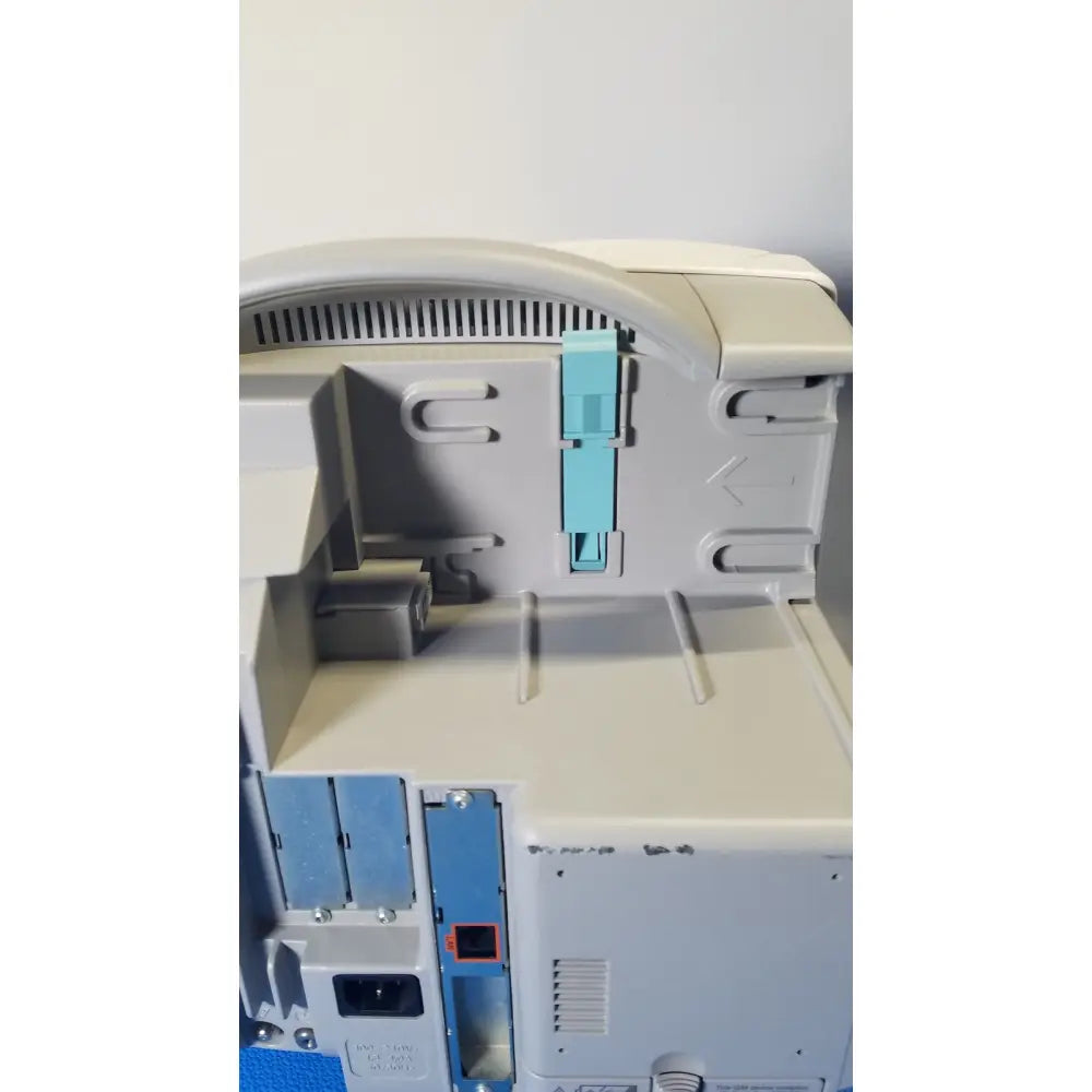 Philips intellivue m8105a patient monitor featuring a gray plastic body with a light blue paper tray insert