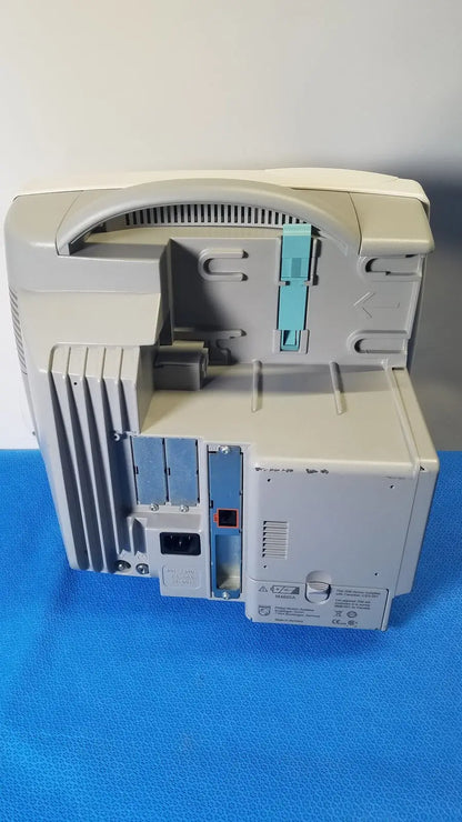 Beige plastic desktop printer with light blue cartridge slot and gray ventilation slats in philips intellivue m8105a patient monitor