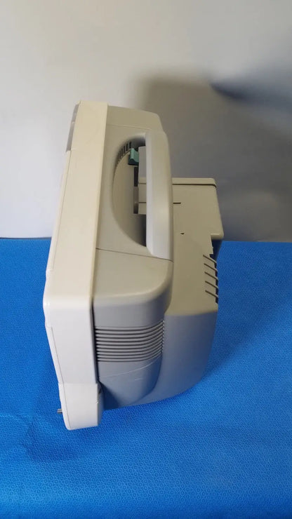 Beige plastic philips intellivue m8105a patient monitor with curved crt screen and integrated stand