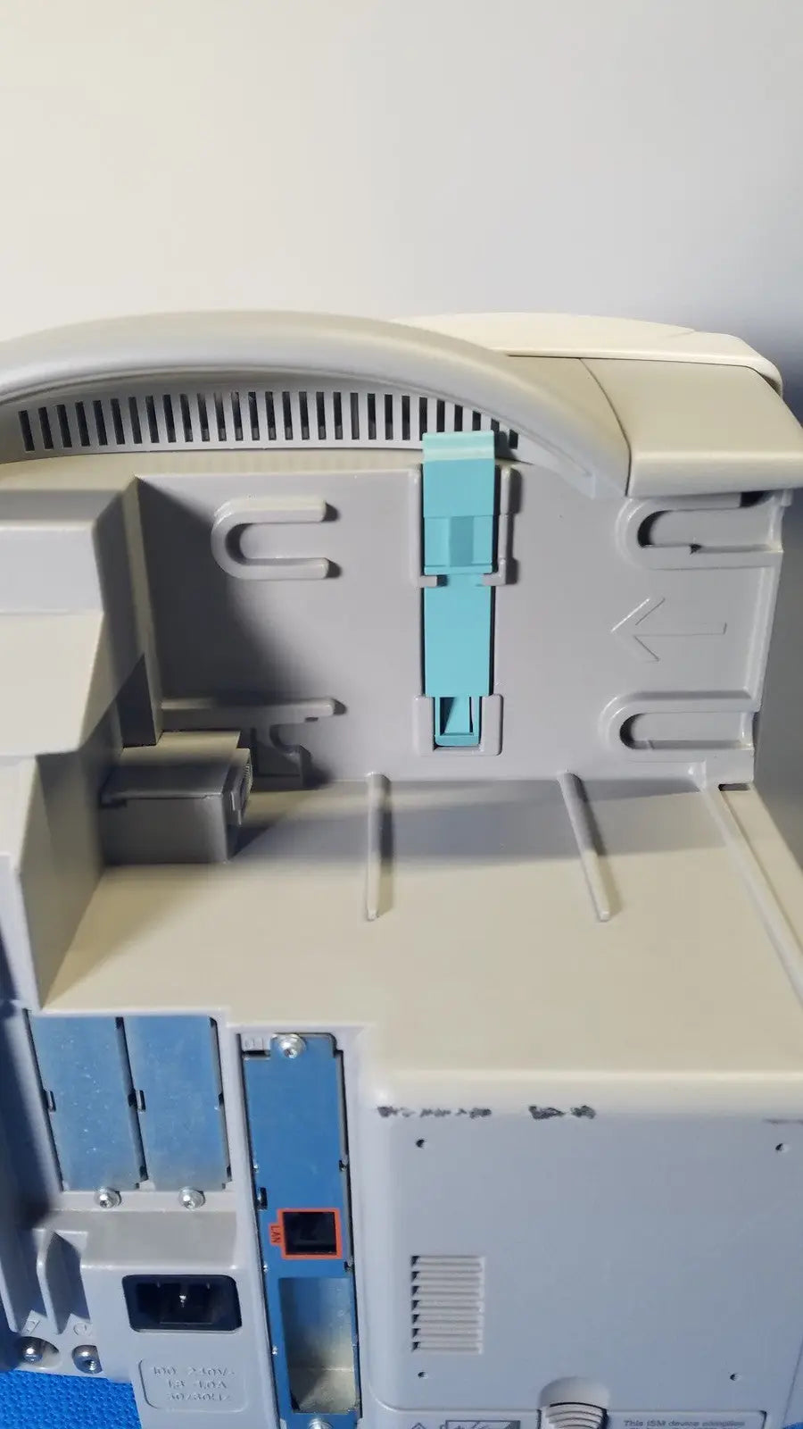 Philips intellivue m8105a patient monitor featuring a gray plastic body with a light blue paper tray insert