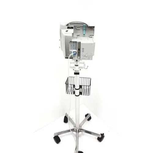 White philips intellivue mp30 m4605a medical monitor mounted on wheeled stand with wire basket for patient monitoring