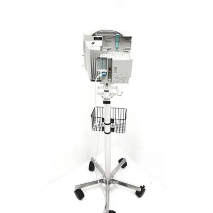 White philips intellivue mp30 m4605a medical monitor mounted on wheeled stand with wire basket for patient monitoring