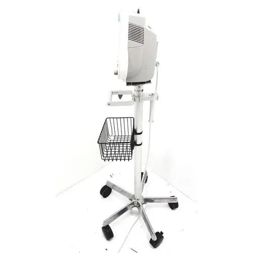 White medical examination lamp mounted on chrome stand with black caster wheels and wire basket for philips intellivue mp30 m4605a