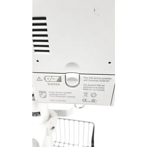 White plastic back panel of philips intellivue mp30 m4605a with regulatory labels on the mp30 m4605a stand device