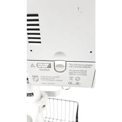 White plastic back panel of philips intellivue mp30 m4605a with regulatory labels on the mp30 m4605a stand device