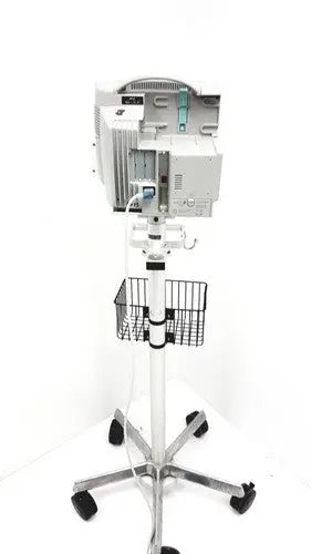 White philips intellivue mp30 m4605a medical monitor mounted on wheeled stand with wire basket for patient monitoring