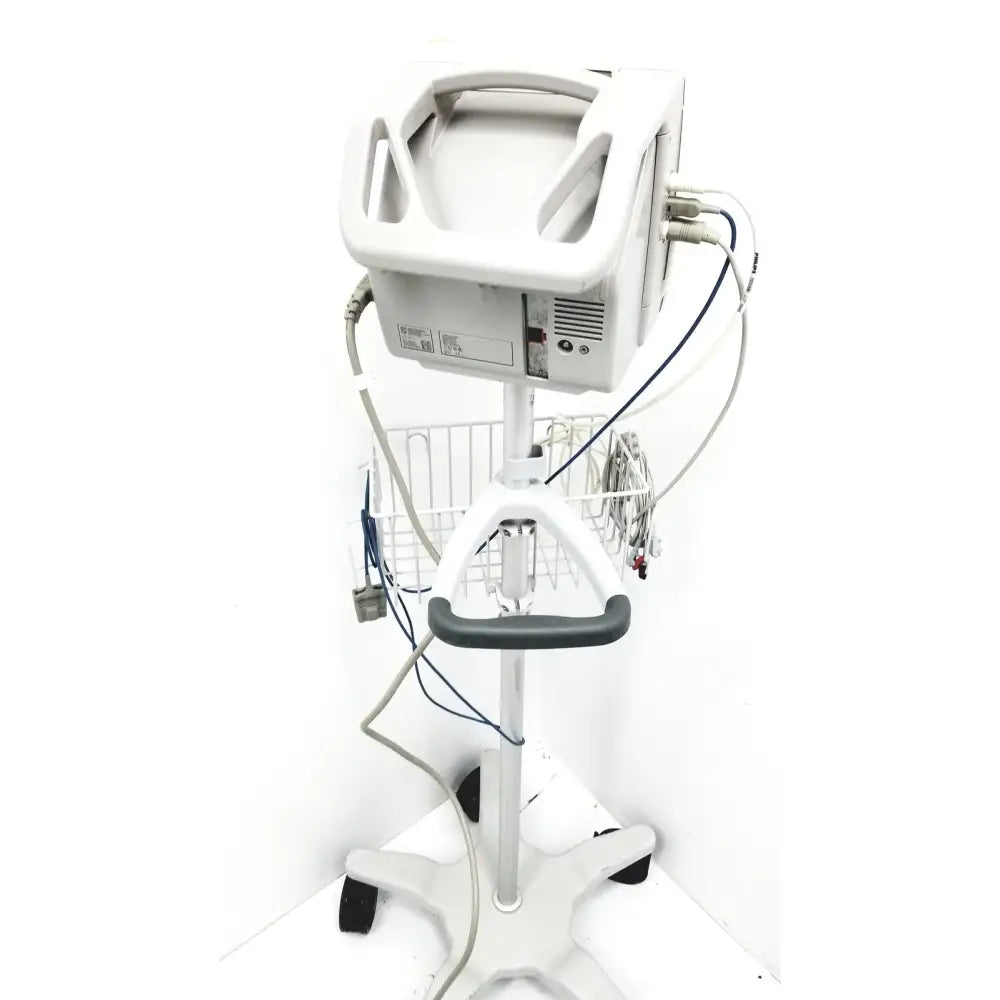 White philips intellivue mp5 patient monitor mounted on a wheeled stand with wire basket and multiple cables