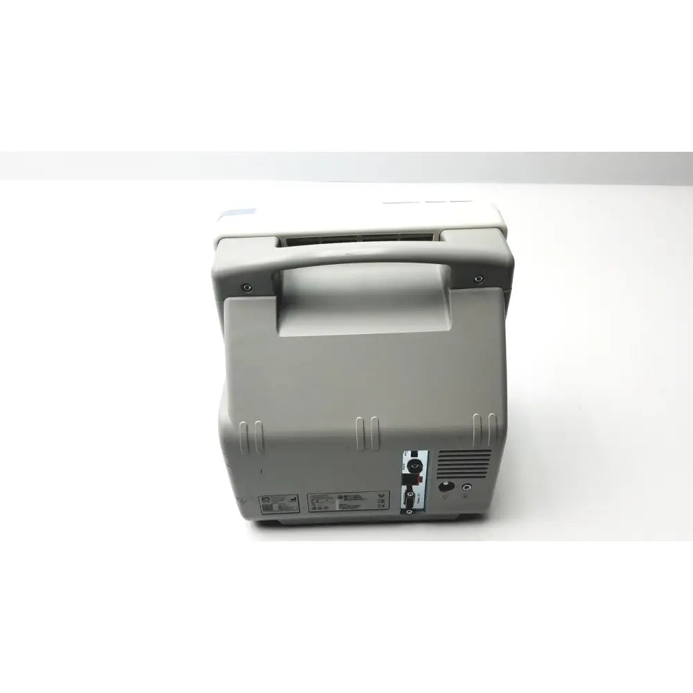 Back view of gray Philips IntelliVue MP5SC touch screen patient monitor with handle and ventilation slots working condition