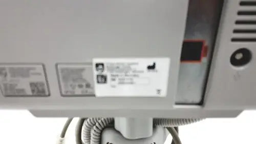 Gray plastic philips intellivue mp5t healthcare monitor showing the back with a white label affixed