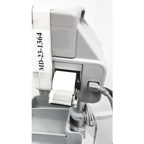 Gray plastic medical printer with white paper roll labeled md-23-1364 attached to philips intellivue mp5t patient monitor