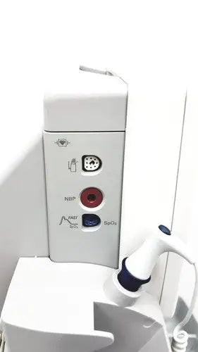 White philips intellivue mp5t patient monitor showing circular ports labeled nibp spo2 and fast bip on back side