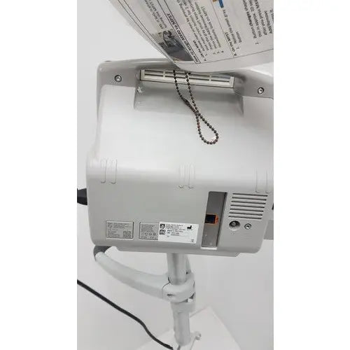 White plastic philips intellivue mp5t patient monitor with ventilation slits and control buttons on rolling stand
