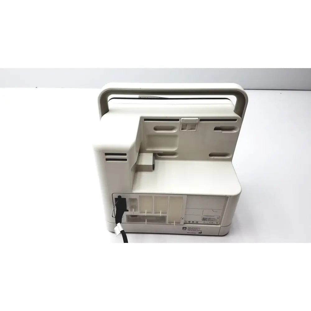 Beige plastic portable philips intellivue mx400 patient monitor ventilator with integrated handle and power cord