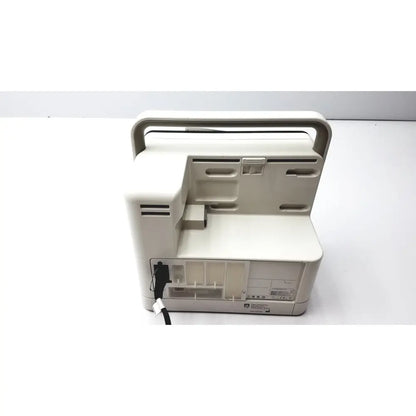 Beige plastic portable philips intellivue mx400 patient monitor ventilator with integrated handle and power cord