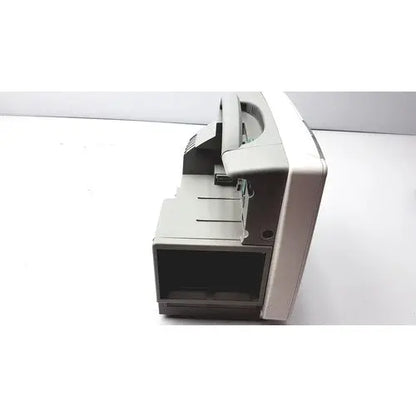 Gray plastic cash counting machine with black display and metallic accents featured alongside philips intellivue patient monitor