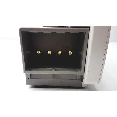 Gray plastic philips intellivue patient monitor with four gold circular connectors visible inside open back compartment