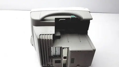 Gray plastic philips intellivue patient monitor with handle and visible internal components for medical use