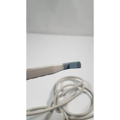 A beige and gray philips l15-7io linear array ultrasound transducer probe with a smooth plastic body
